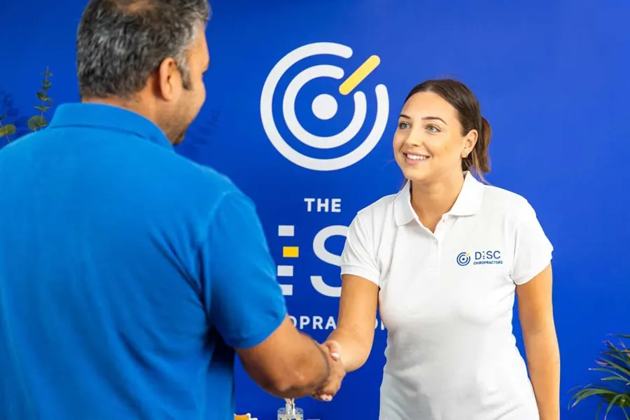 A patient being welcomed at reception